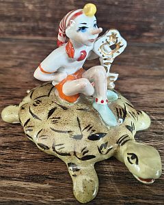 Buratino on a turtle porcelain figurine